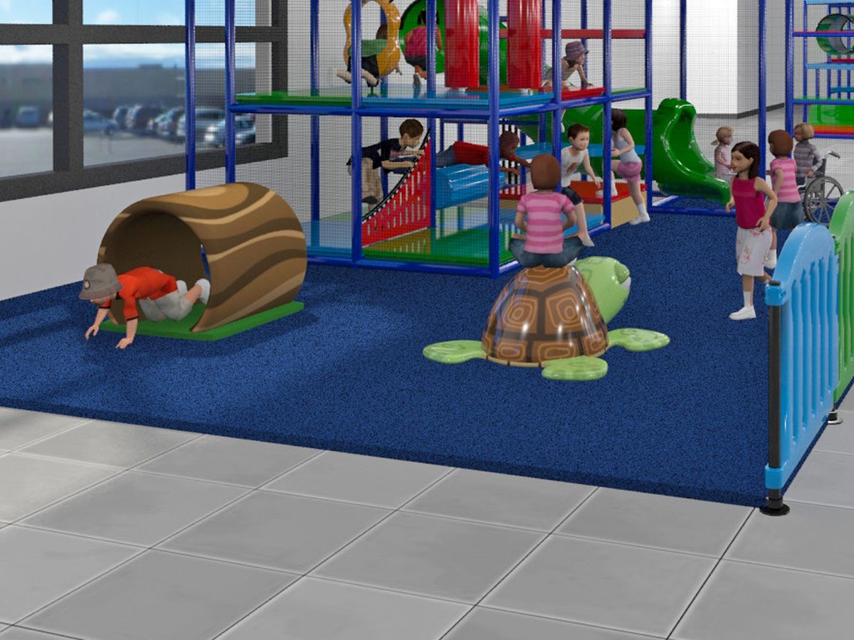Toddlers crawling through a log tunnel and climbing a turtle, with a child using a wheelchair nearby